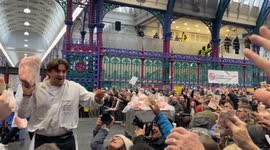Hundreds of bidders at Smithfield Market Christmas Eve Meat Auction 2024 in London