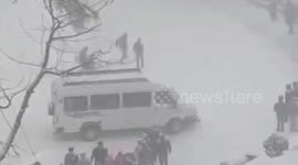 Bus driver crashes while negotiating slippery snow-covered road