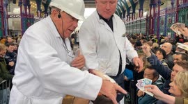 Happy bidders at the Smithfield Market Christmas Eve Meat Auction 2024 in London