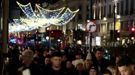 Last-minute festive shoppers pile into London's West End on Christmas Eve