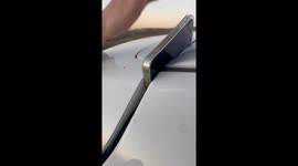 Phone Gets Stuck in Tiny Gap Between Car Panels