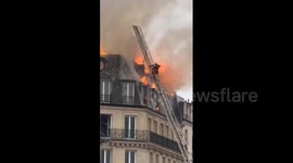 France: Christmas Eve Fire Engulfs Top Floor Of Building Near Paris Saint-Lazare Station