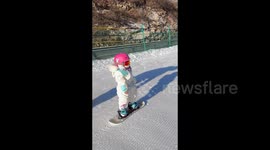 China: Two-Year-Old Falls Asleep While Skiing