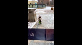 Snowy slip-up: Little girl tumbles after winter fun