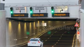 Cars enter the Piazza Pia underpass, opened after redevelopment works for the Jubilee, on Christmas Eve in Rome.