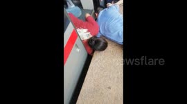 China: A Baby Was Rescued from The Gap Between the Train and The Platform