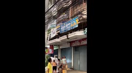 Locals save cat stuck on building ledge using old poster