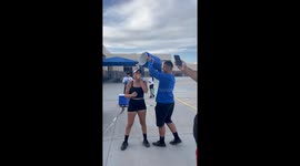 Bucket of ice water poured on a highschool teenager by another boy for fun