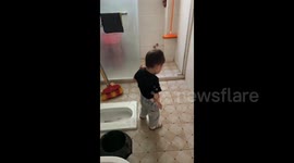 China: A Kid Falls into the Toilet