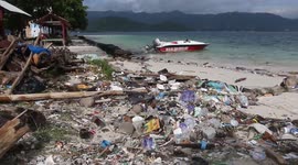 AN ISLAND SURROUNDED BY GARBAGE FROM SUMATERA AND JAVA IN HOLIDAY SEASON