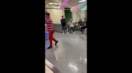 Blindfolded colleagues play hilarious game trying to hit eggs with bottles