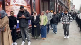 Long queue outside Harrods store in Knightsbridge, London as people rush to shop for Boxing Day sales