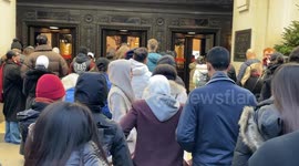 Queue outside Selfridges store on Oxford Street in London as people rush to shop for Boxing Day sales.