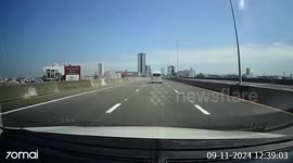 Loose tyre from moving van bounces along road