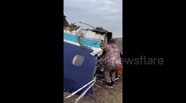 Emergency services battle to free plane passengers in Kazakhstan