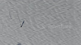 Man Writes Merry Christmas In Snow