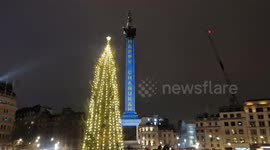 A menorah shines bright in Trafalgar Square during a rare occurance Chanukah coincides with Christmas Day