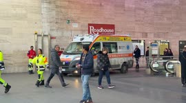 An ambulance with its flashing lights leaves Termini Station in Rome.