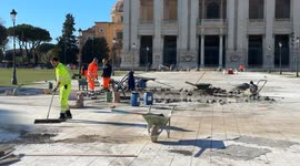 Workers at work on the construction site for the redevelopment of the square in front of the papal Basilica of St. John Lateran on the occasion of the Jubilee in Rome.