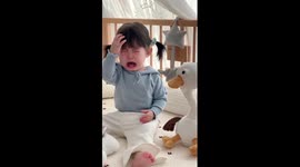 Toddler terrified by interactive toy bursts into tears