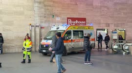An ambulance with its flashing lights leaves Termini Station in Rome.
