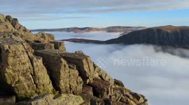 Incredible fog-covered view while hiking on Helvellyn Mountain, UK