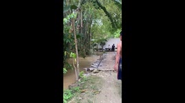 Flood destroys bamboo bridge in Tuban, Java, Indonesia