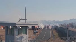 Fire trucks surround South Korea plane crash wreckage