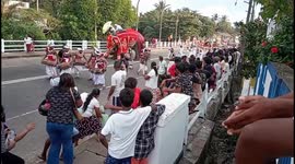 aggressive elephant attack to man on the road in the festival Sri Lanka