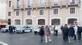 People walking and in the background the facade of the new Spanish Embassy which, once the renovation work is completed, will have its headquarters in Piazza Navona in Rome.