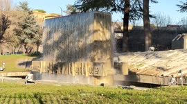 The vertical stele sculpted with bas-reliefs of the Fontana dell'Acea (Acea's fountain), built in 1962, placed in front of the Acea (Municipal Electricity and Water Company) office building in Rome.