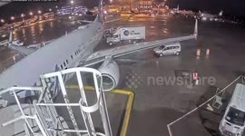 Passengers opens plane door and walks along the WING