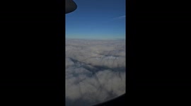 Pilot's halo rainbow appears on clouds below aircraft