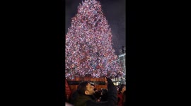 Crowds enjoy fake snow in Covent Garden as the UK braces itself ahead of a storm on NY Eve