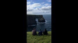 3 Friends Sit Together with a Beautiful View