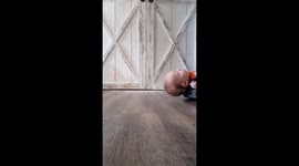 Son Relaxes On Robot Vacuum