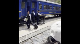 Woman Saved From Stepping In Front Of Moving Train
