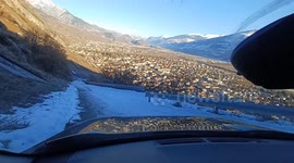 DRIVING DOWNHILL  27% steep  half-frozen swiss alpine road in an SUV with electronic downhilll-control.