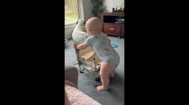 Son Slides Smoothly Over Camp Chair
