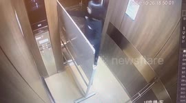China: A Girl Gets Stuck in the Elevator While Moving a Whiteboard