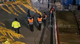 Security stop two trespassing men from getting onto Southbank from Thames beach to watch NYE fireworks