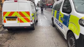 Police cordon off the scene of a stabbing on Oxford Street in central London