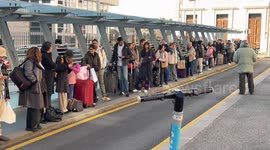 Many people line up for a taxi to arrive outside Termini Station on New Year's Day in Rome.