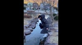Man slips on frozen river in Jiangxi, China