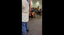 Woman Straightens Her in an Airport