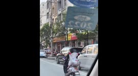 Charming encounter: Playful child in yunnan brings joy to passersby