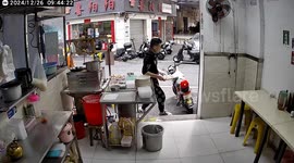 Man accidentally slips and knocks over table in Guangdong, China