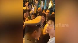 Japanese tourist attacks policeman who was ordering him not to release lantern