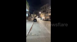 Palestine: Israeli forces fire tear gas canisters towards Palestinian youths during their raid on the city of Dura