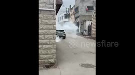 West Bank: Israeli forces fire tear gas canisters during their raid on the village of Awyref, south of Nablus in the West Bank